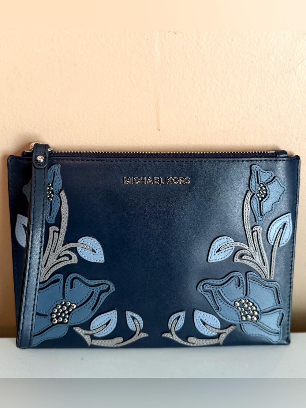 Michael Kors Navy Floral Appliqué Wristlet with Light Blue Accents